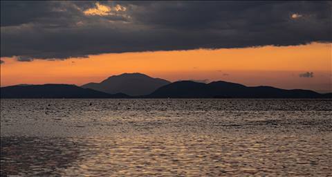 Three Worlds, an Island Between